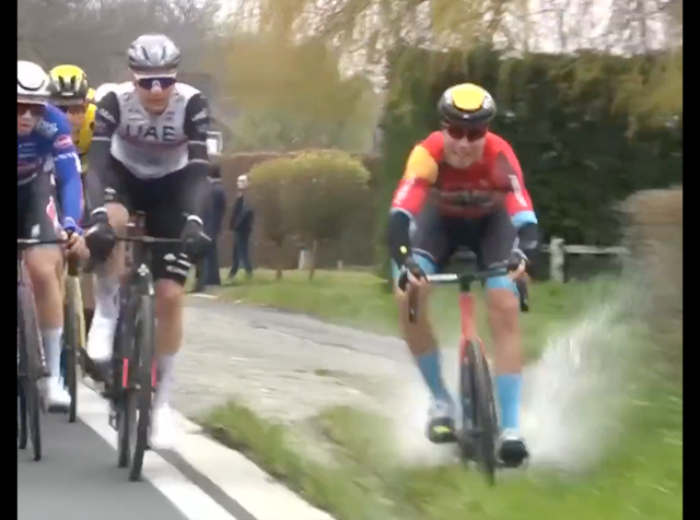 <p>Filip Maciejuk loses control riding through a puddle on a grass verge</p>