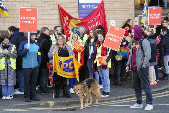 Members of the PCS union on the picket line outside the Passport Office in Glasgow (Jane Barlow/PA)