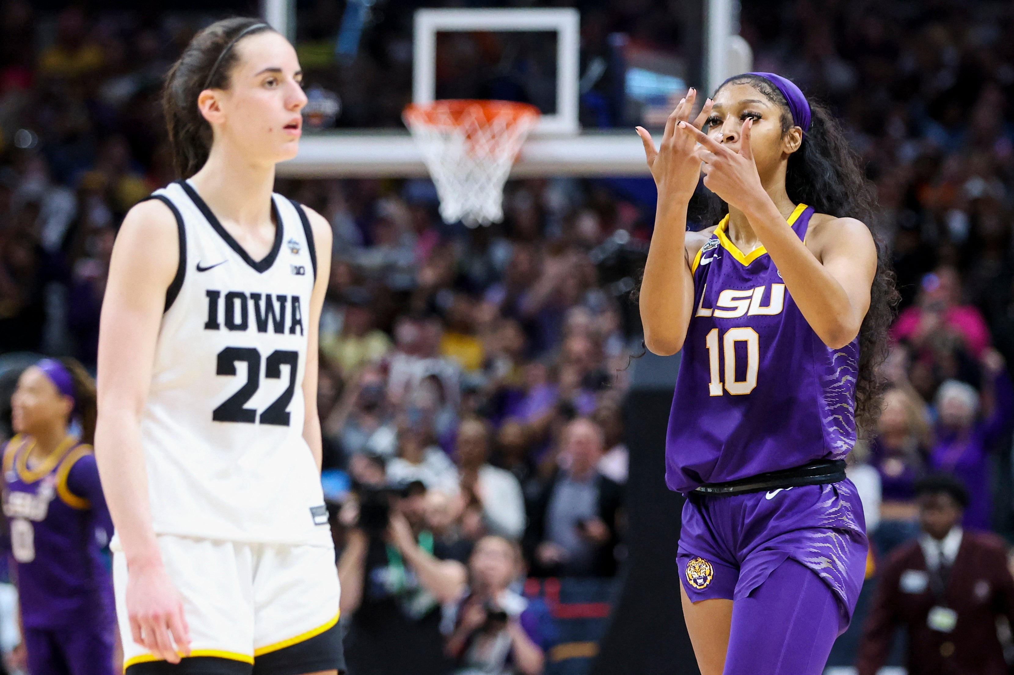 LSU Lady Tigers forward Angel Reese (10) gestures towards Iowa Hawkeyes guard Caitlin Clark (22) after the final round of the Women's Final Four NCAA tournament at the American Airlines Center