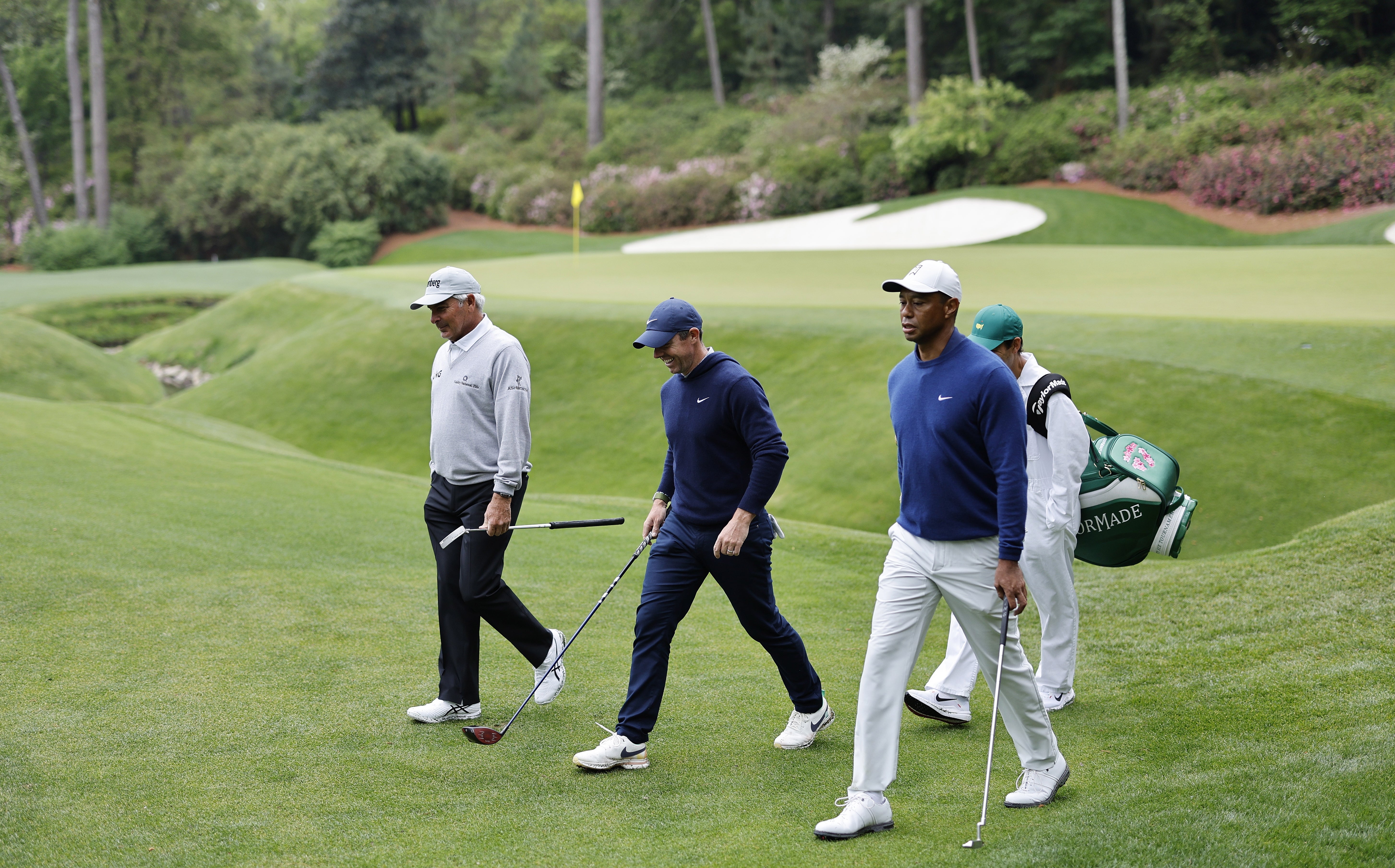 Rory McIlroy practicing at Augusta with Fred Couples and Tiger Woods