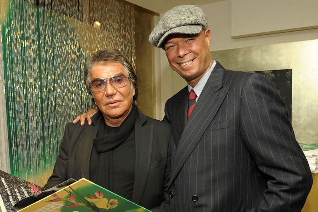 <p>Michael Roberts (right) with Roberto Cavalli in 2009</p>