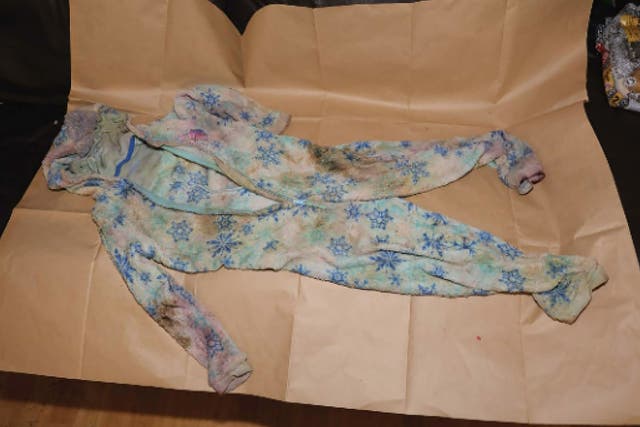 Lola James’s wet and vomit and blood-stained onesie was found partly hidden in the corner of the living room (CPS)