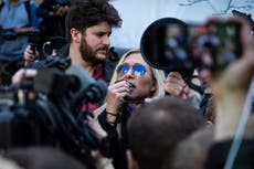 Counter-protest forces Marjorie Taylor Greene to flee Trump arraignment as she compares him to Mandela