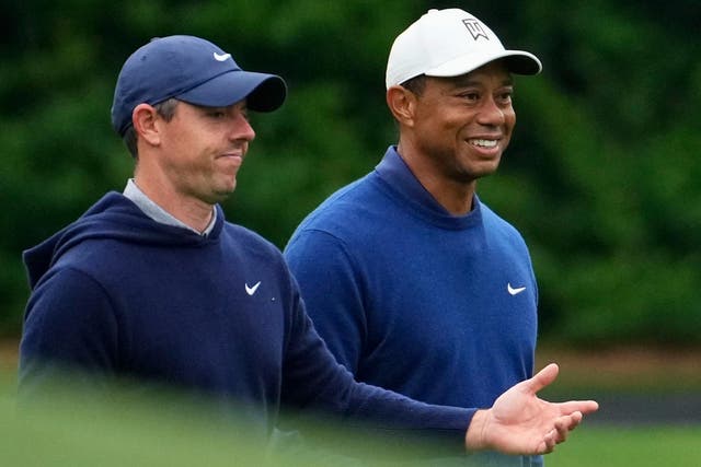 Tiger Woods (right) believes it is a ‘matter of time’ before Rory McIlroy wins the Masters (Matt Slocum/AP)