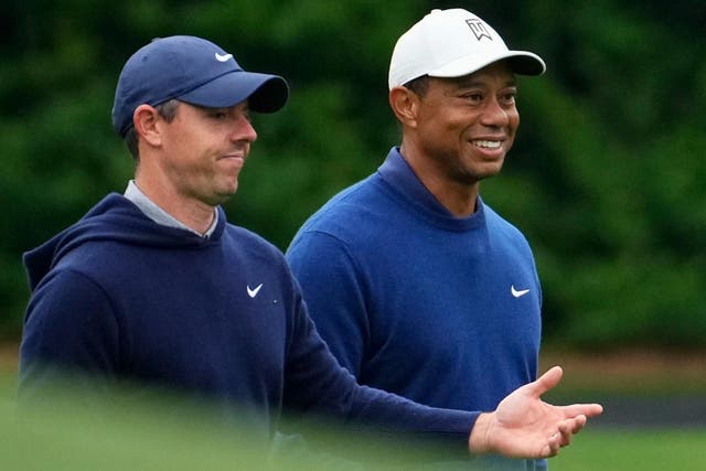 Tiger Woods (right) believes it is a ‘matter of time’ before Rory McIlroy wins the Masters (Matt Slocum/AP)