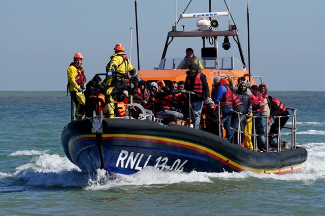 A group of people thought to be migrants are brought in to Dungeness, Kent, onboard the RNLI Life Boat following a small boat incident in the Channel. Picture date: Tuesday April 4, 2023.
