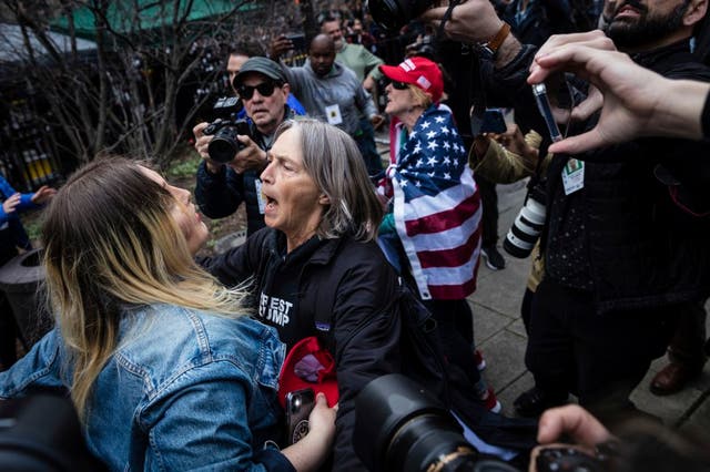 <p>Protesters argue at the Collect Pond Park across the street from the Manhattan District Attorney's office in New York on Tuesday, April  4, 2023.  Former President Donald Trump will surrender in Manhattan on Tuesday to face criminal charges stemming from 2016 hush money payments.  (AP Photo/Stefan Jeremiah)</p>
