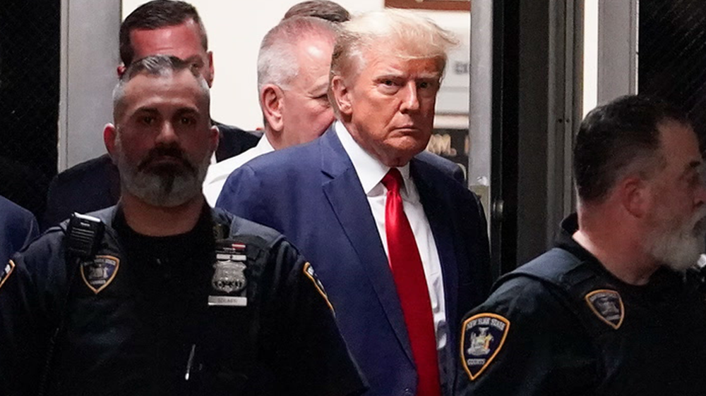 Former President Donald Trump enters a Manhattan court, Tuesday, April 4, 2023, in New York.