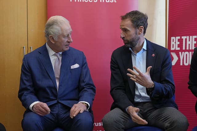 The King talks to Gareth Southgate, England football manager and Prince’s Trust ambassador, during a visit to the Norbrook Community Centre in Wythenshawe (Frank Augstein/PA)
