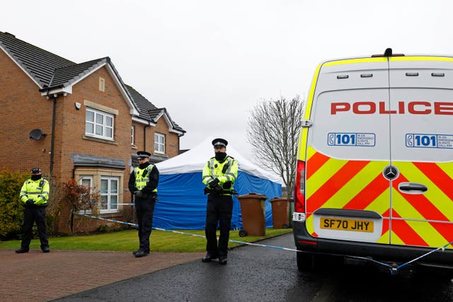 <p>Police officers stand guard outside the home of Peter Murrell and Nicola Sturgeon in Glasgow, Scotland</p>