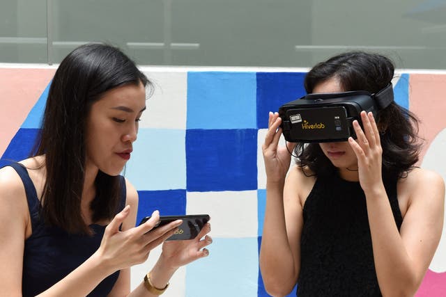 <p>A student is guided through a virtual reality simulation at the Nanyang Technological University in Singapore on 10 March, 2020</p>