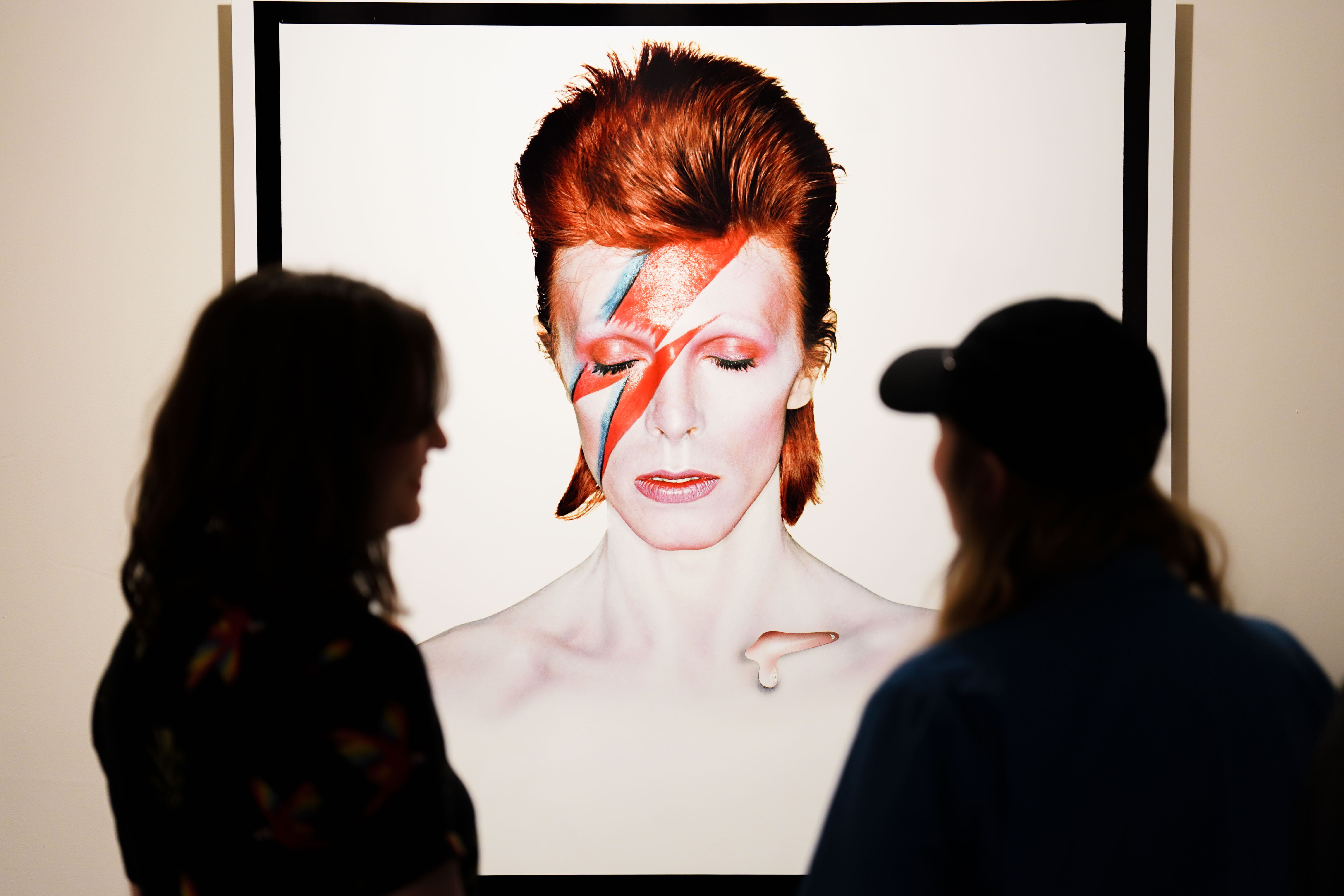 People look at the Aladdin Sane: 50 Years exhibition at the Southbank Centre in London (James Manning/PA)