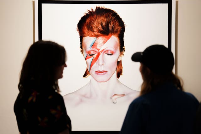 People look at the Aladdin Sane: 50 Years exhibition at the Southbank Centre in London (James Manning/PA)