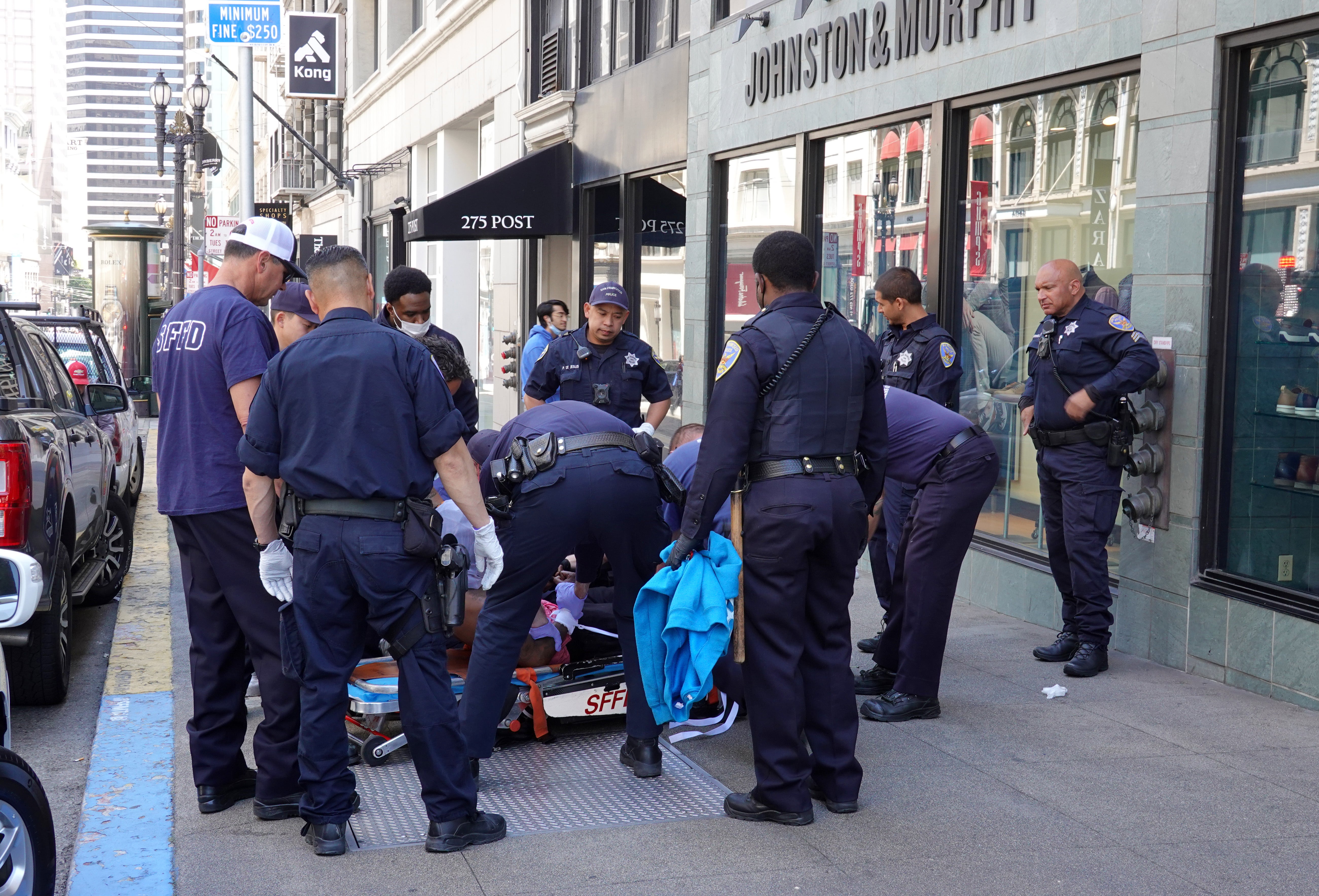 San Francisco police officers assist San Francisco firefighters during a medical call on May 24, 2022 in San Francisco, California