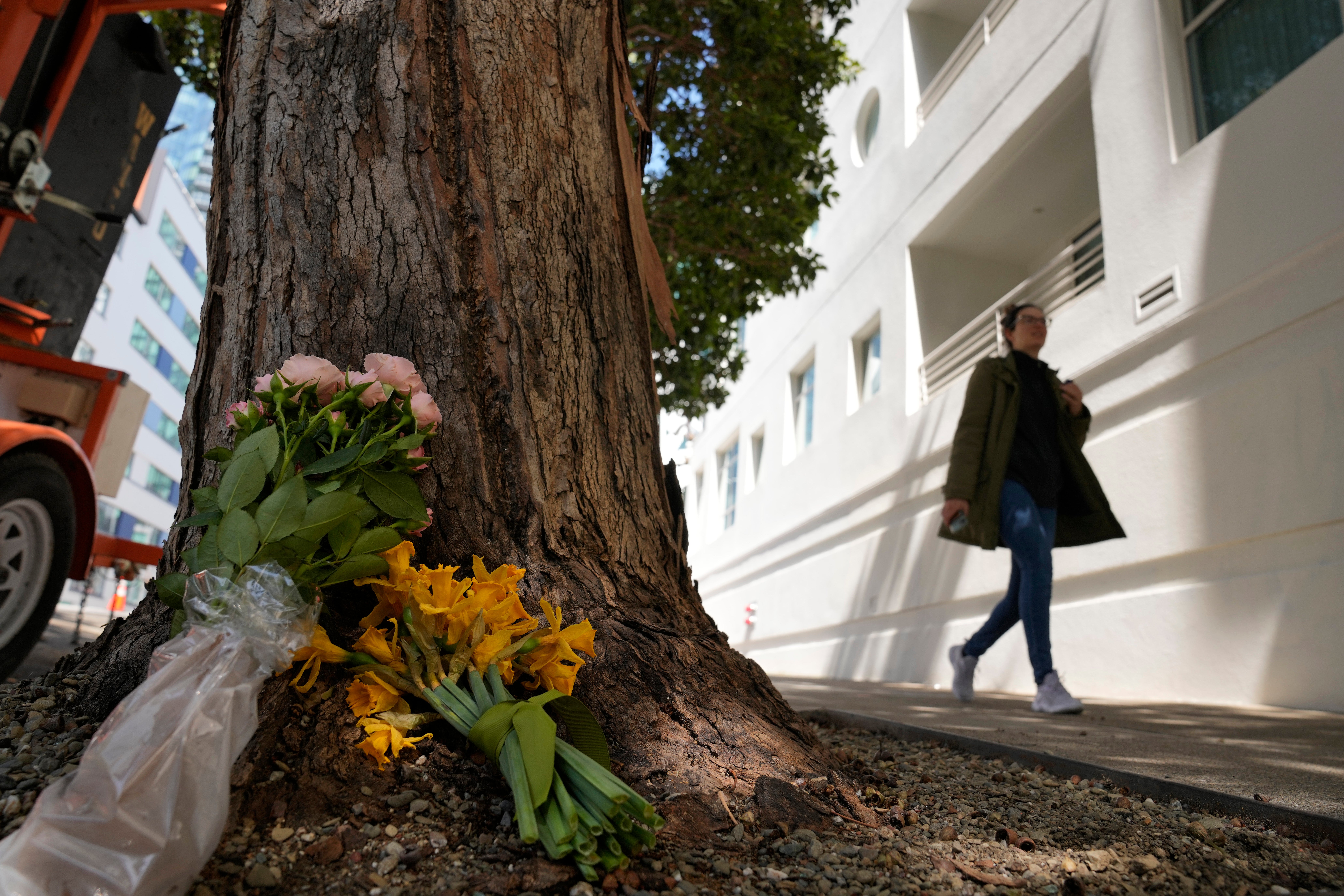 Flowers have been left outside an apartment building where Bob Lee was fatally stabbed in San Francisco
