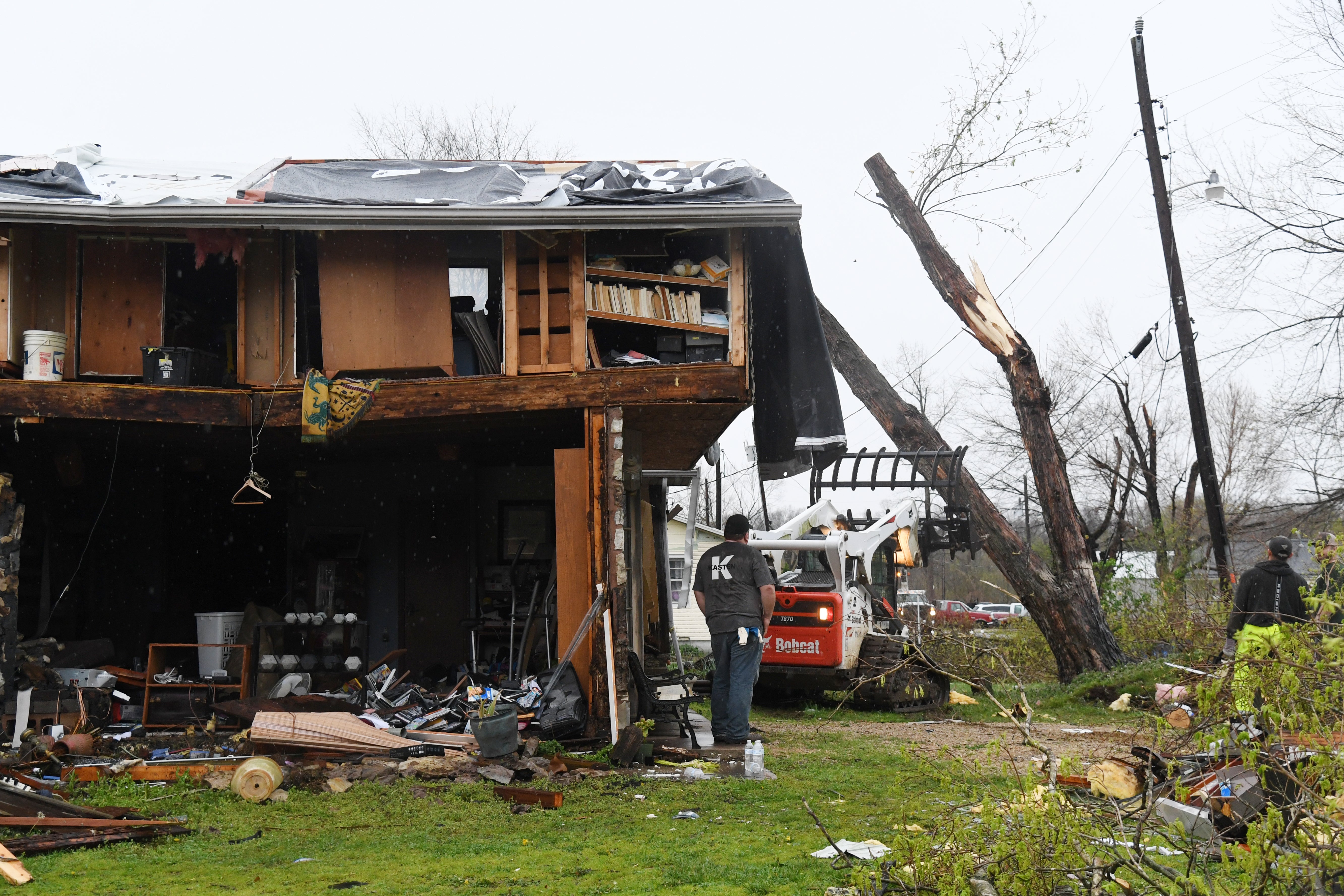 Residents clean up after a tornado touched downon April 5, 2023 in Glenallen, Missouri. At least five people have been killed and multiple others injured