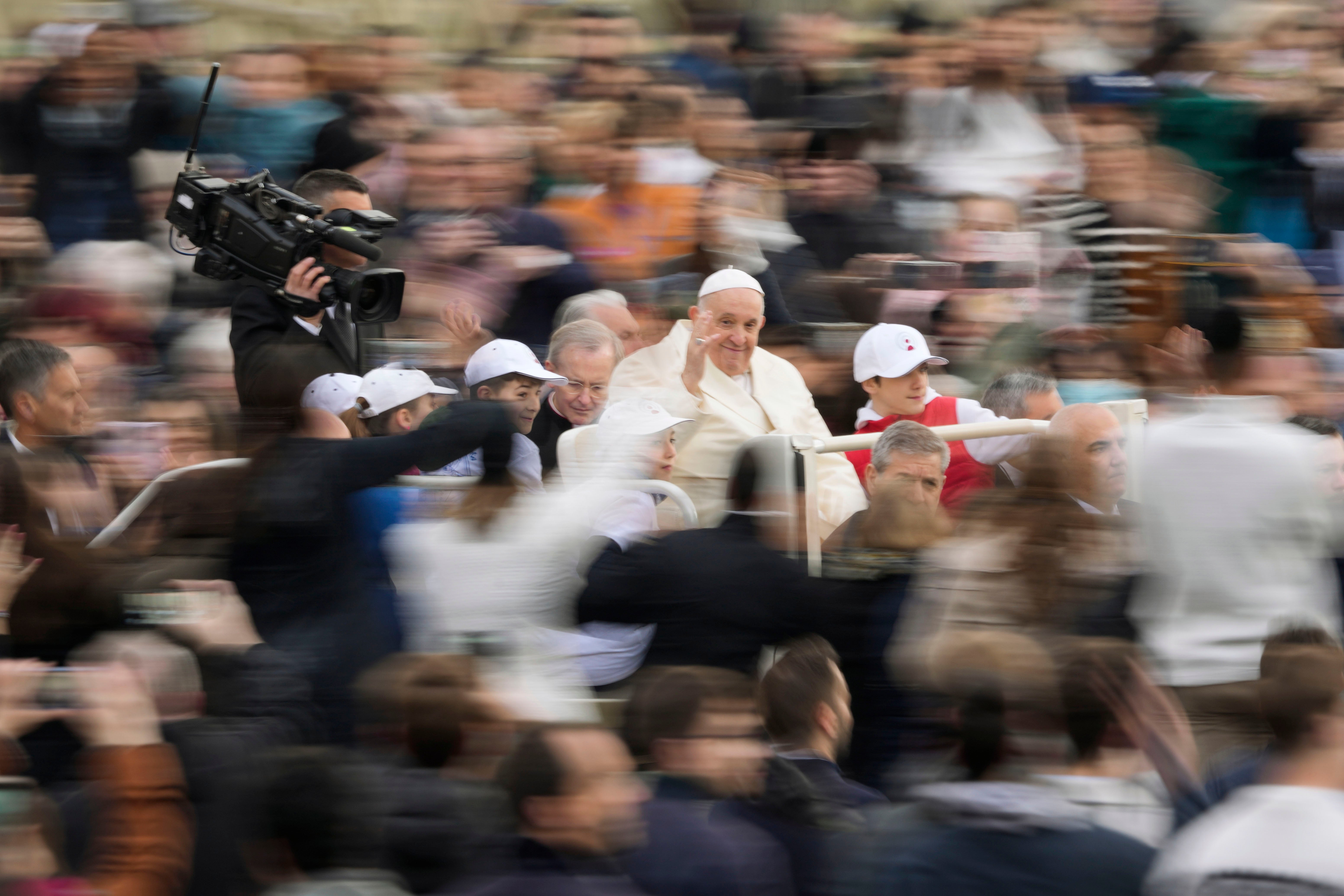 Pope Francis waves as he arrives for his weekly general audience in St Peter’s Square at The Vatican, Wednesday, 5 April 2023