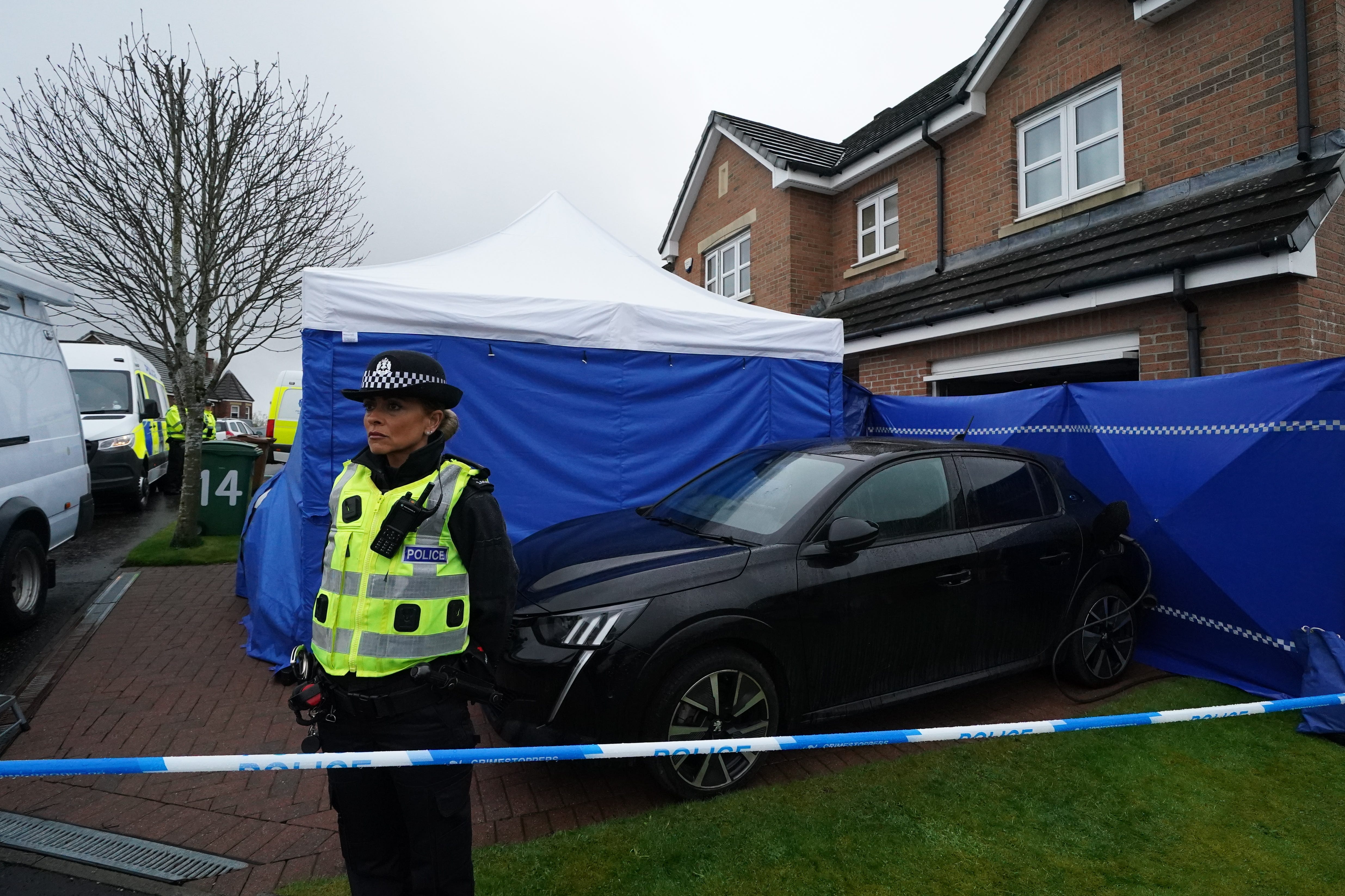 Officers from Police Scotland outside the home of former chief executive of the Scottish National Party (SNP) Peter Murrell (Andrew Milligan/PA)