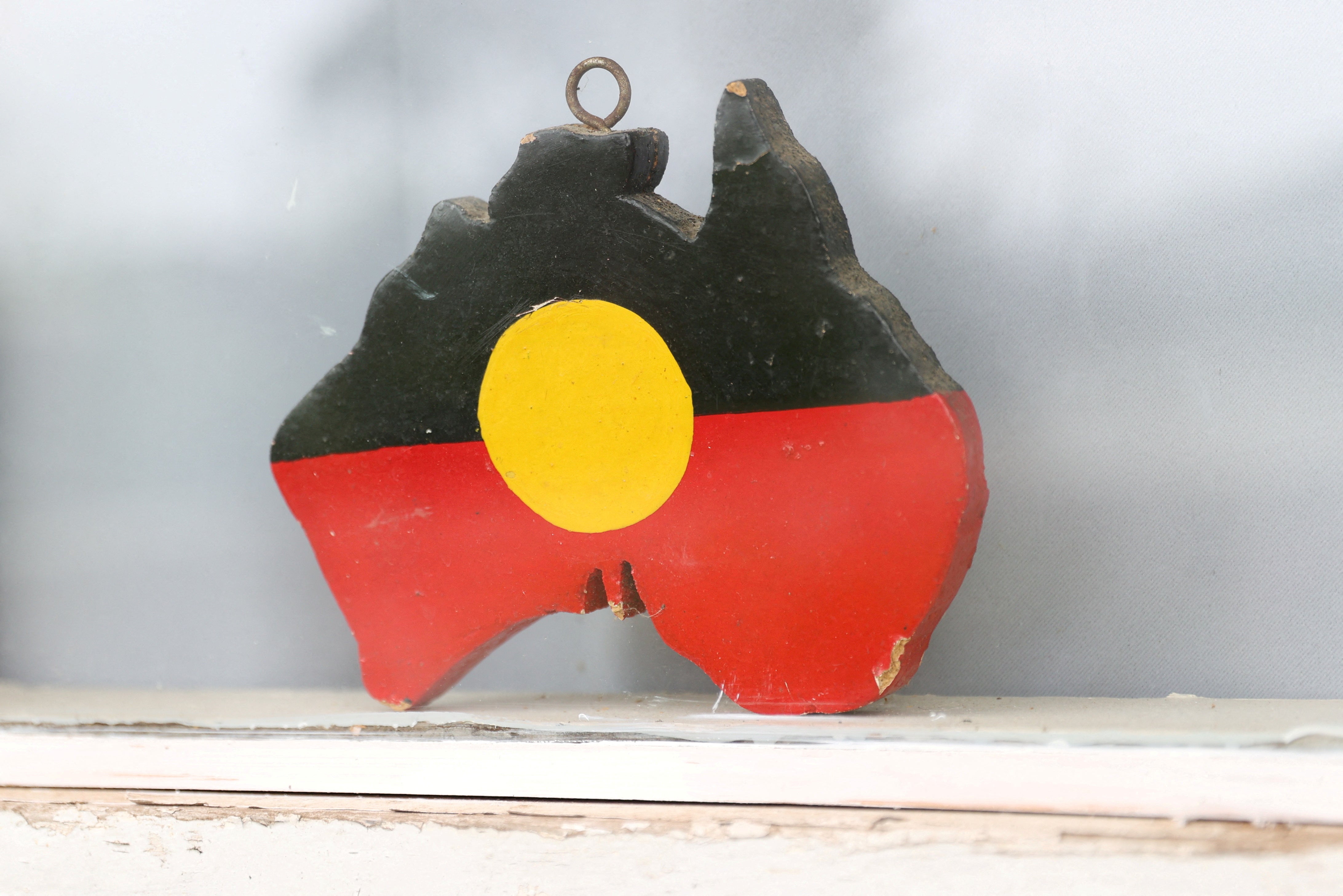 FILE: A depiction of the Australian Aboriginal Flag is seen on a window sill in Sydney