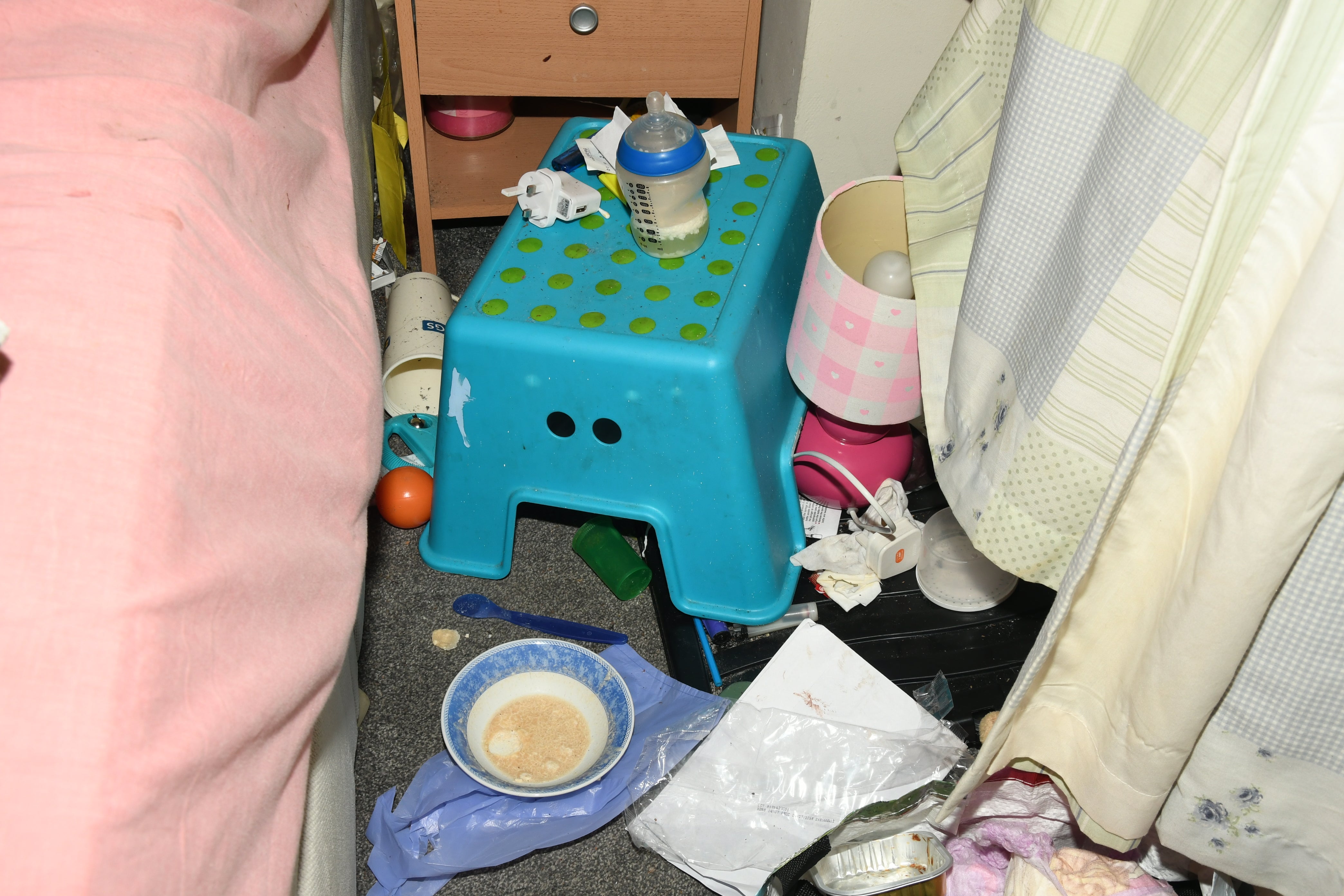 A mouldy baby’s bottle surrounded by litter in Finley’s bedroom
