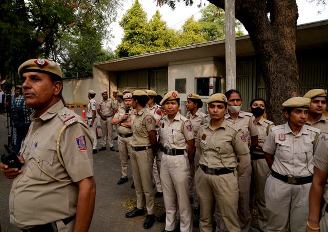 <p>Representational image: Policemen stand guard as Indian Sikhs protesting against the pulling down of Indian flag from the Indian High Commission building in London gather outside the British High Commission in New Delhi on 20 March</p>
