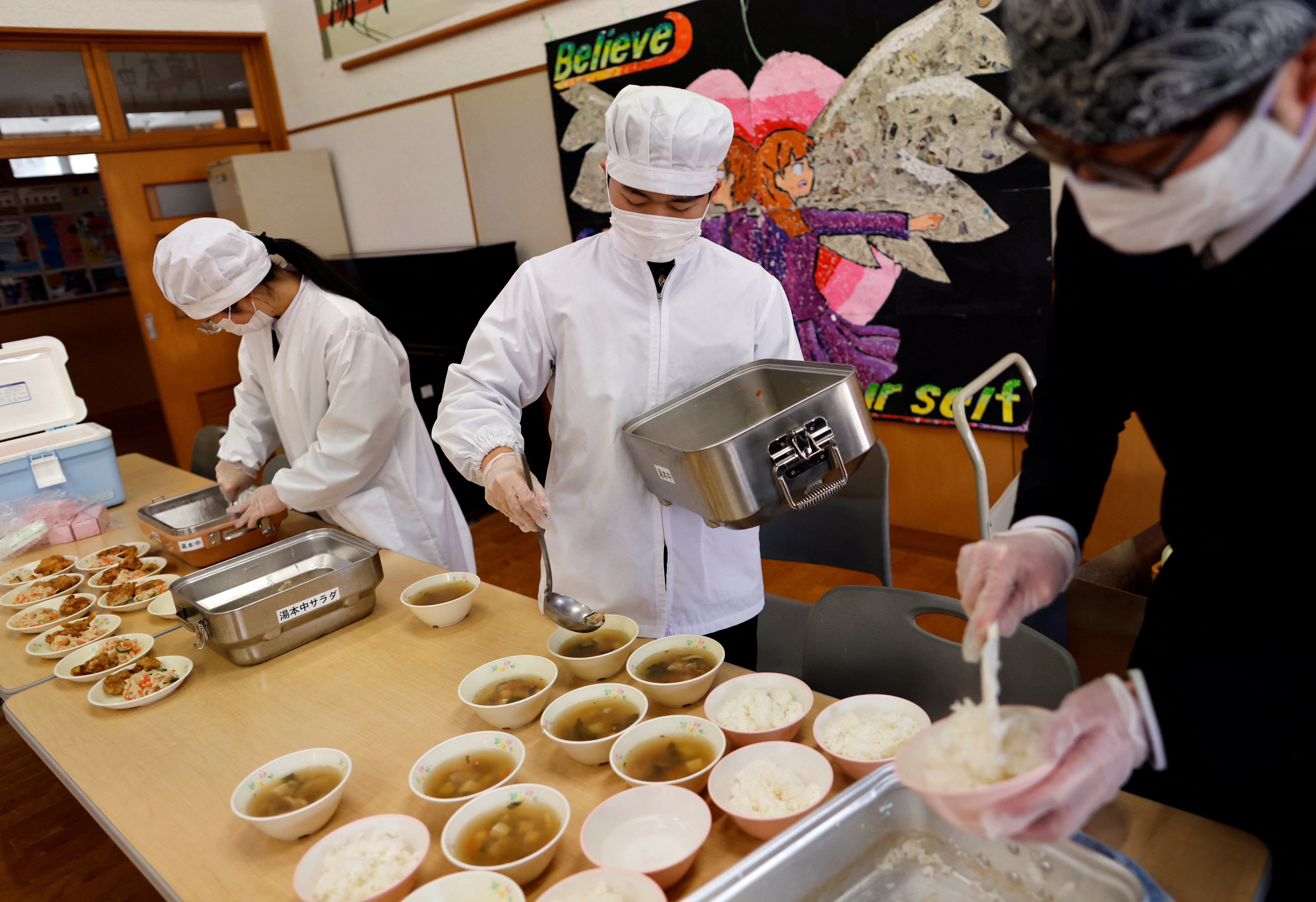 Plenty to go around... being served their last school lunch