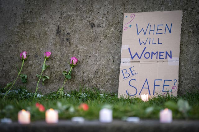 Flowers and candles that were placed at a vigil being held in honour of Fawziyah Javed (Jane Barlow/PA)