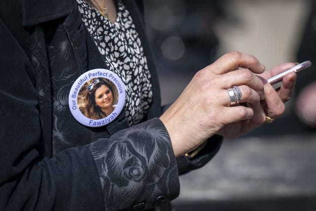 A family member wears a badge in memory of Fawziyah Javed outside the High Court in Edinburgh (Jane Barlow/PA)