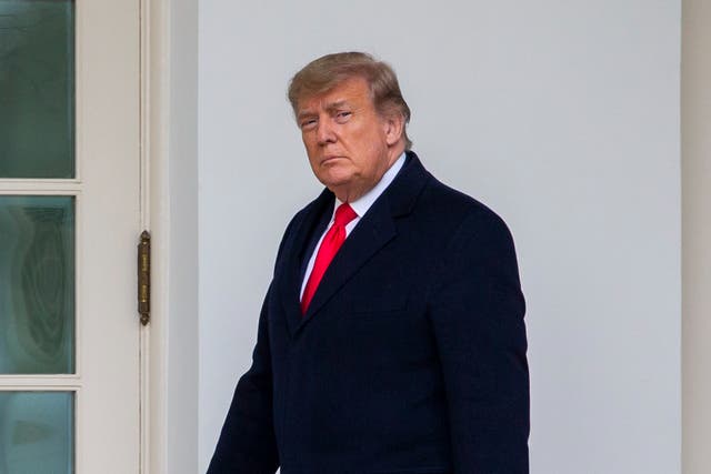 <p>U.S. President Donald Trump walks to the Oval Office while arriving back at the White House on December 31, 2020 in Washington, DC</p>