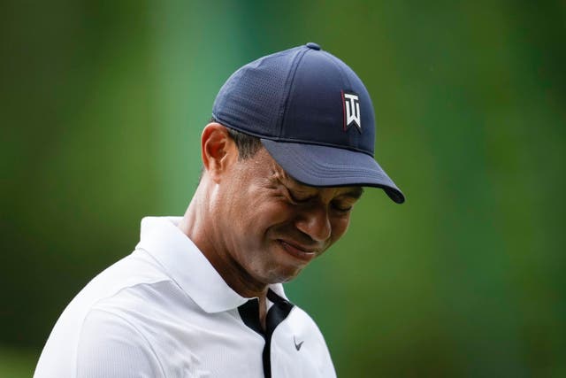 Tiger Woods grimaces on the fourth tee during the first round of the Masters (Matt Slocum/AP)