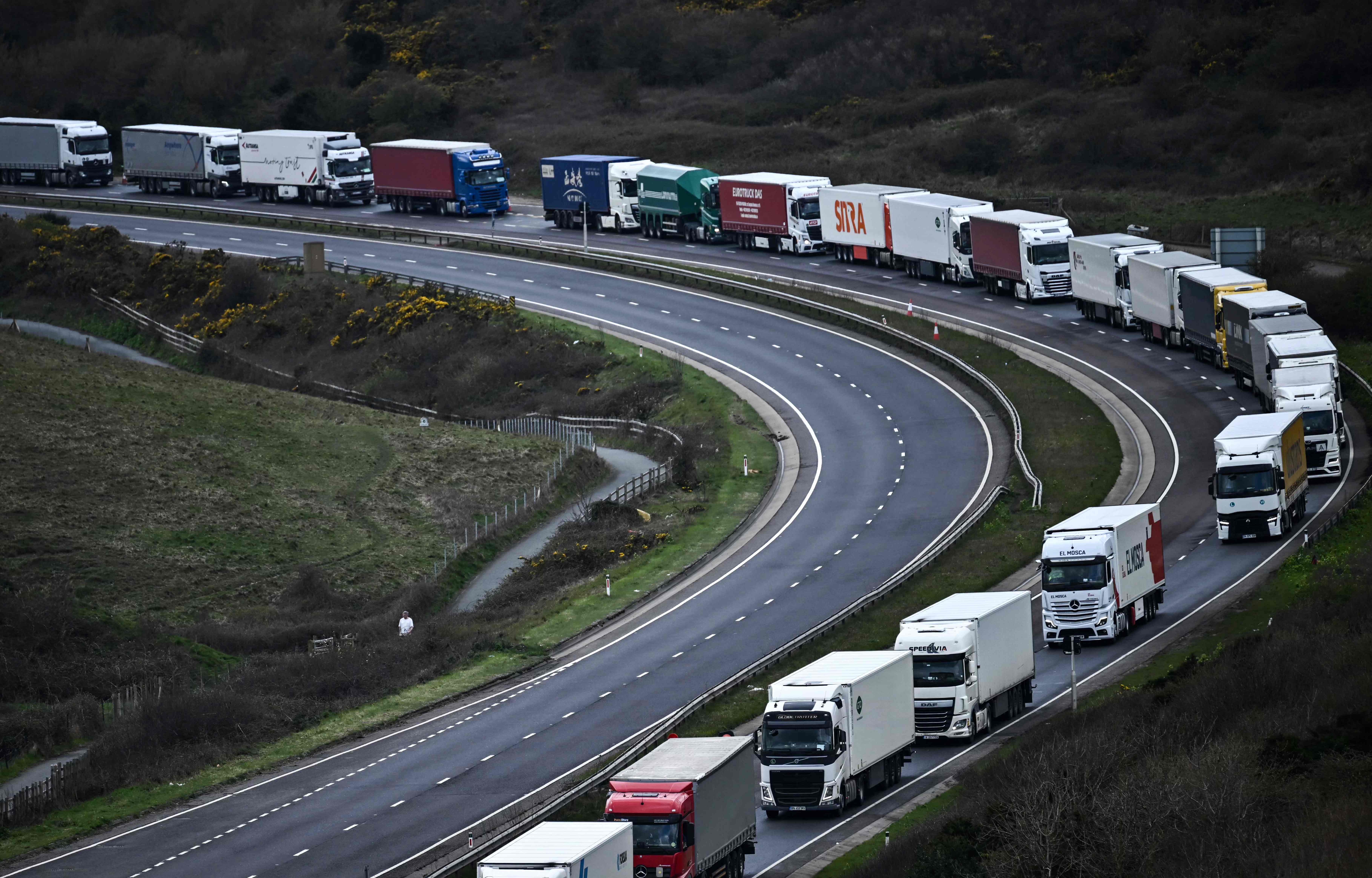 Freight lorries, HGVs (heavy goods vehicles) and cars queue on the A20 road towards the Port of Dover in April earlier this year