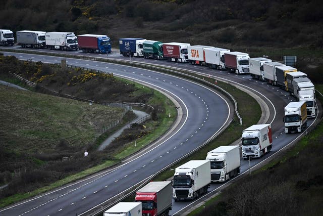 <p>Freight lorries, HGVs (heavy goods vehicles) and cars queue on the A20 road towards the Port of Dover in April earlier this year </p>