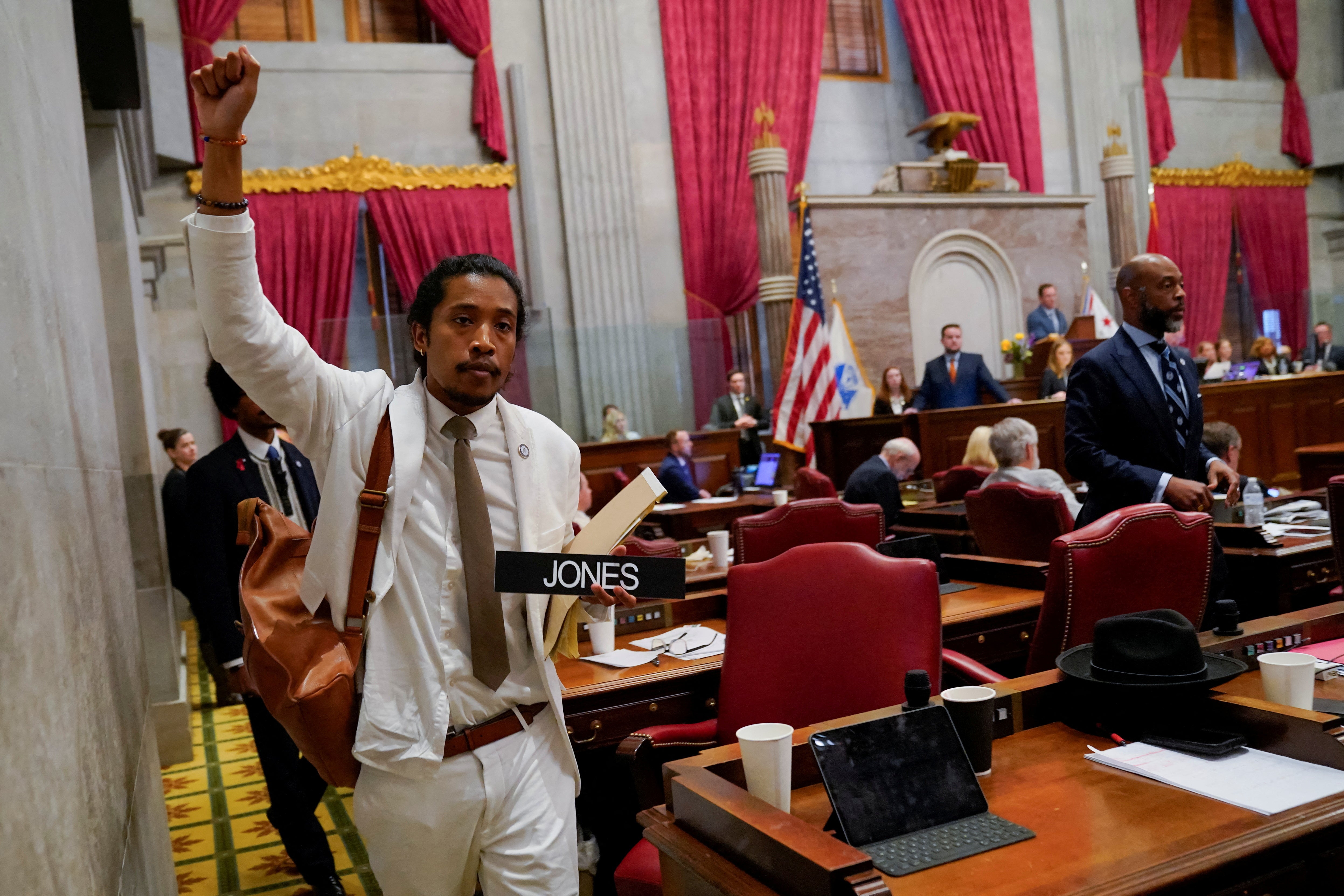 Justin Jones carries his name tag after a vote at the Tennessee House of Representatives to expel him for his role in a gun control demonstration at the statehouse last week