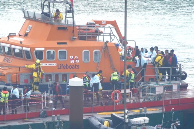 A group of people thought to be migrants are brought in to Dover, Kent, from the RNLI Dover Lifeboat following a small boat incident in the Channel (Gareth Fuller/PA)