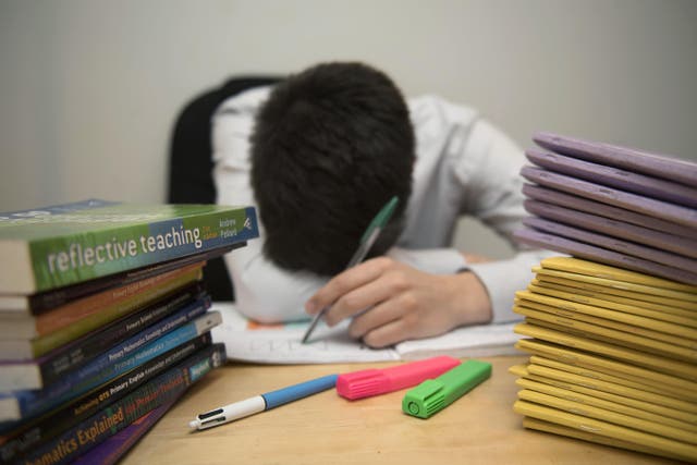 A NASUWT survey found 83% of teachers believe their job has adversely affected their mental health over the last 12 months (PA)