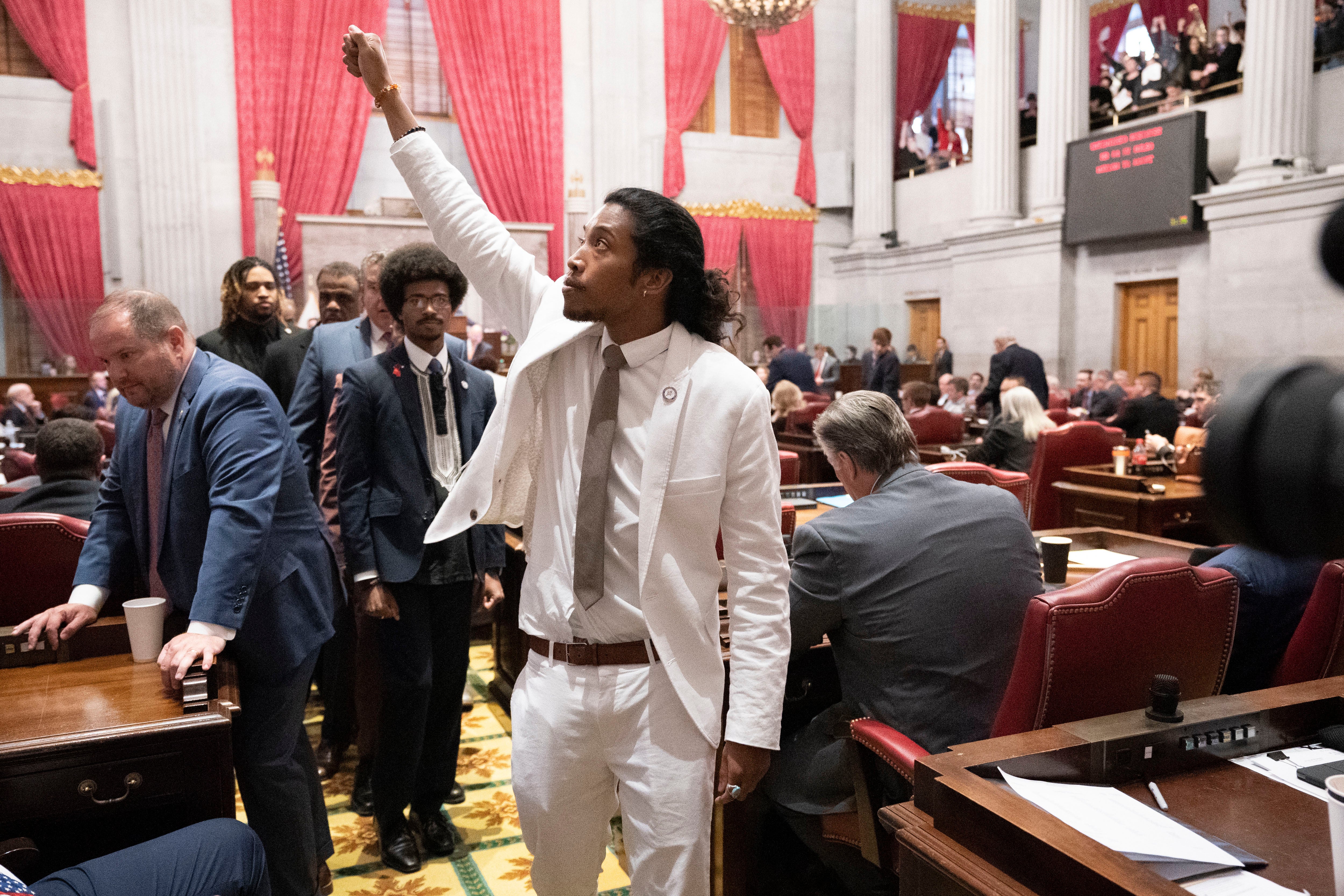 Rep Justin Jones raises his fist on the floor of the Tennessee House chamber after being expelled from the legislature on 6 April