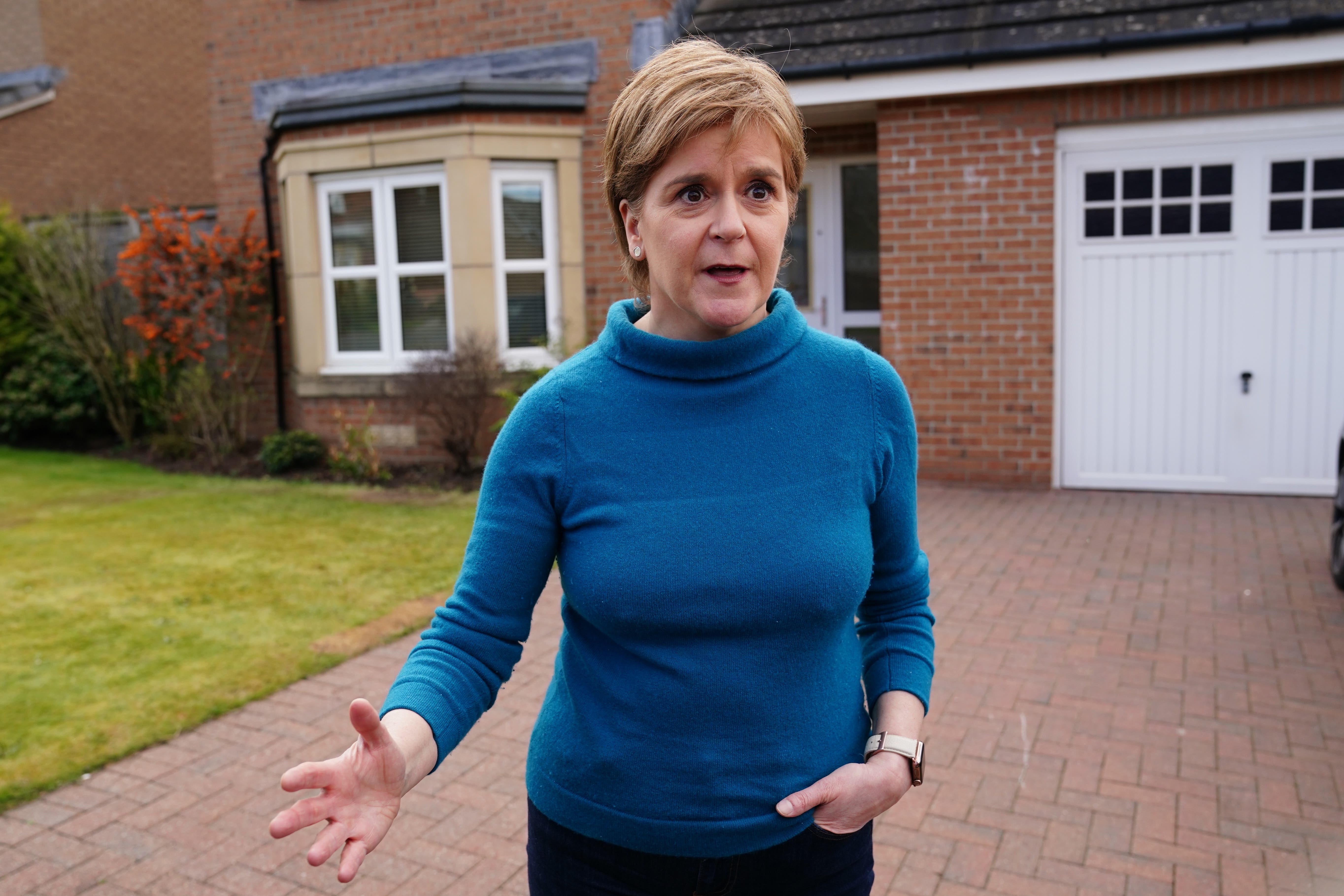<p>Nicola Sturgeon gave a brief statement to the media outside her home in Uddingston, Glasgow (Jane Barlow/PA)</p>
