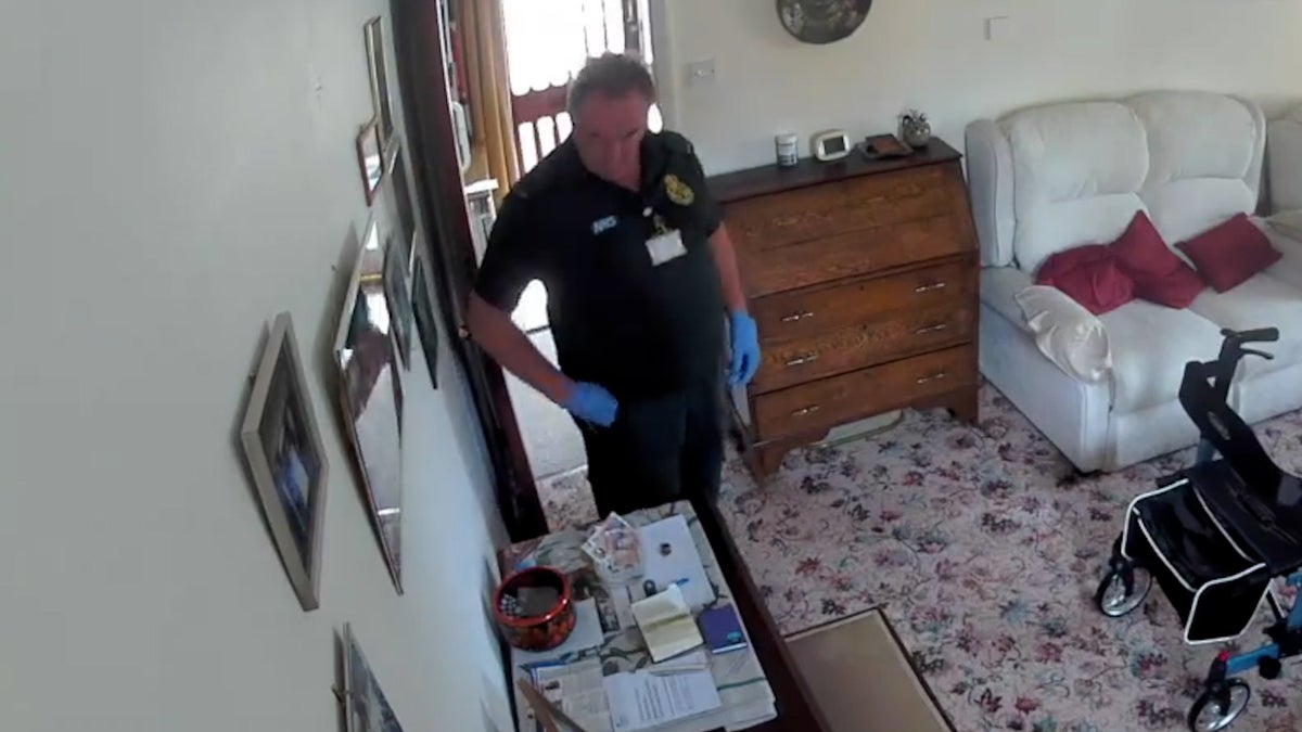 Moment paramedic caught stealing money from 94-year-old woman minutes after she died