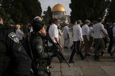 Defiant Jewish settlers march to evacuated West Bank outpost