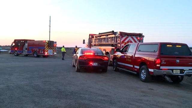 <p>First responders at the scene where two police officers were fatally shot in Cameron, Wisconsin, on Saturday</p>