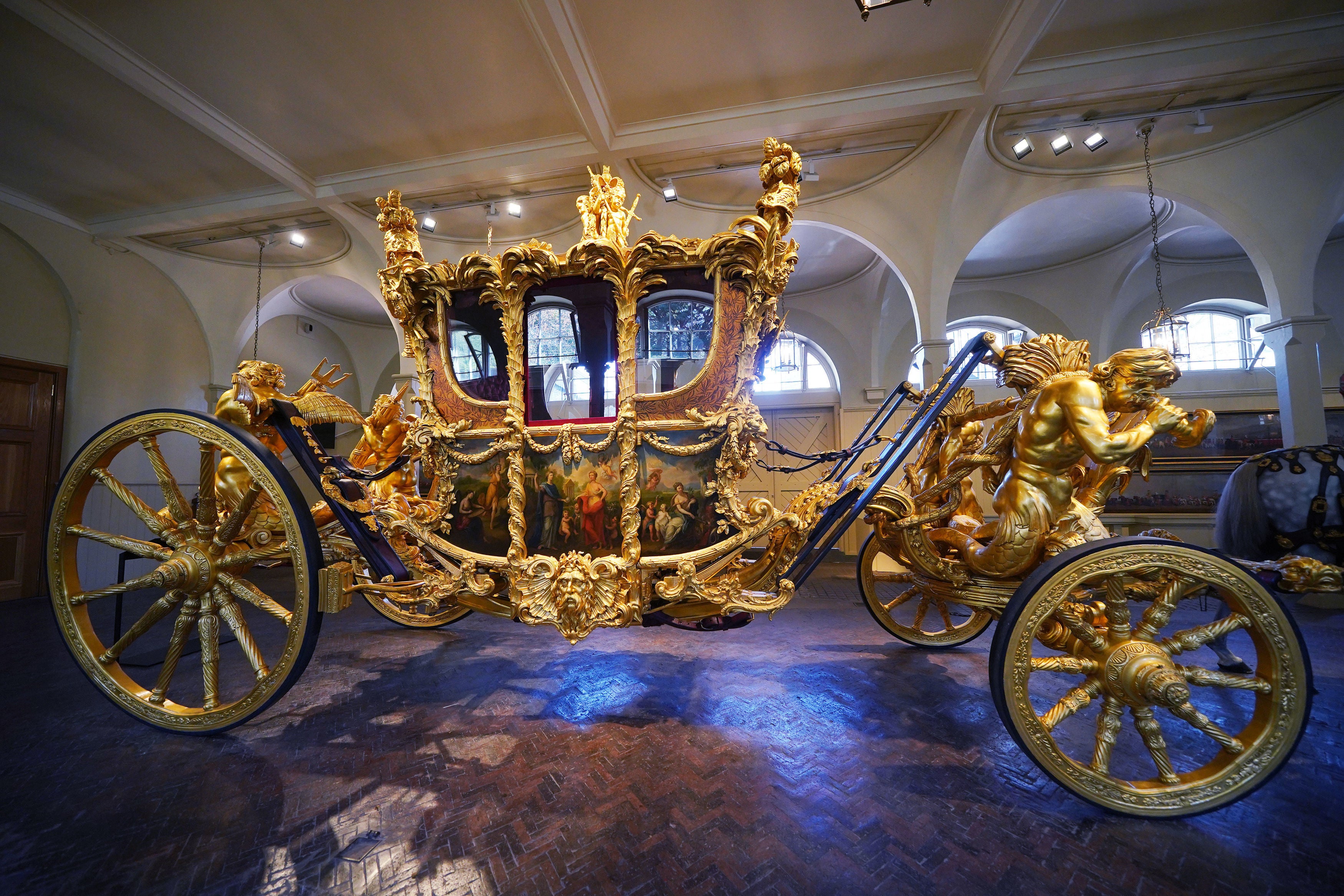 The Gold State Coach on display at the Royal Mews in Buckingham Palace, London, ahead of King Charles III’s Coronation on 6 May