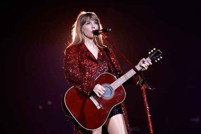 <p>Swift on stage at the Eras tour</p>