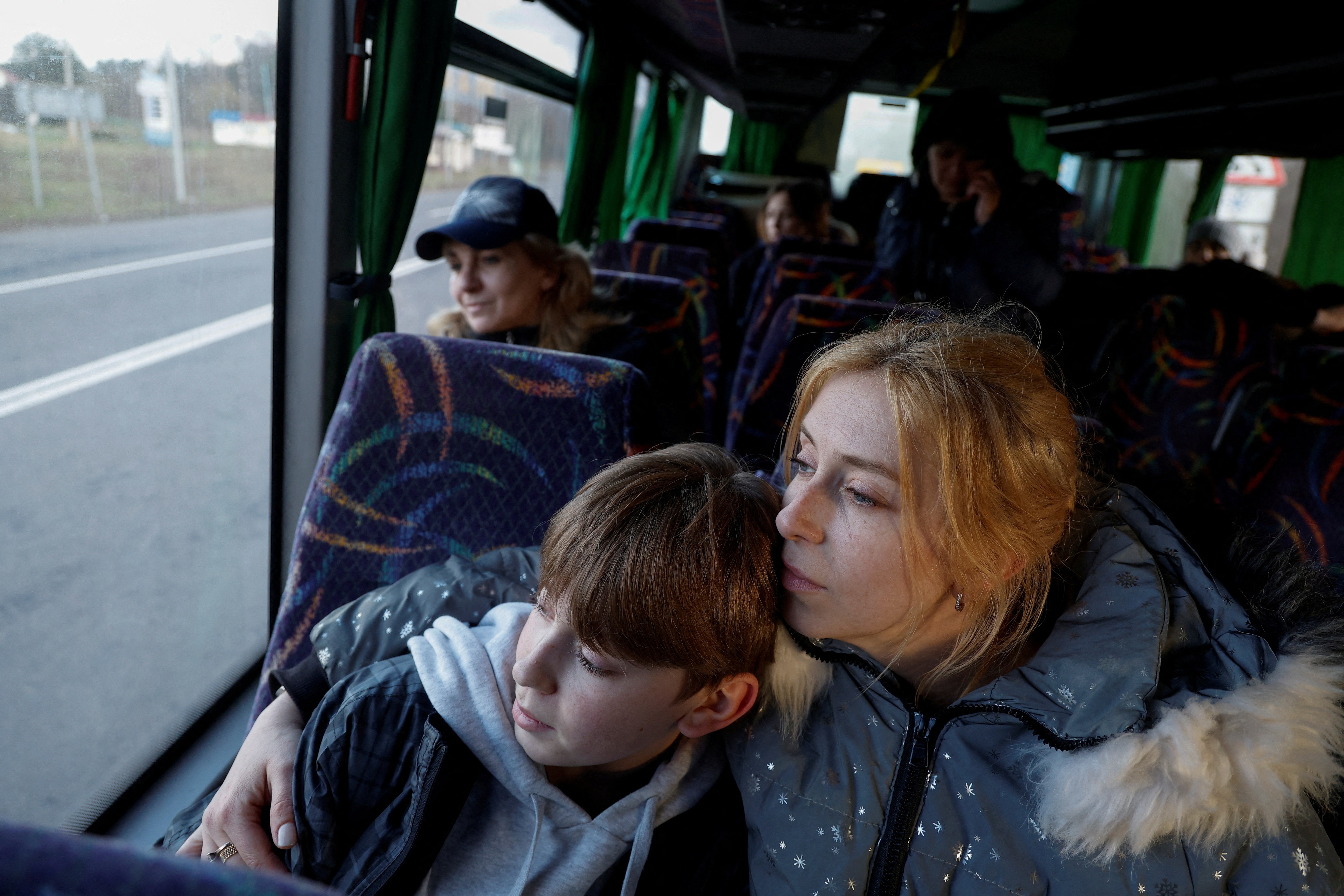 <p>Alla Yatsentiuk embraces her 14-year-old son Danylo, who went to a Russian-organised summer camp from non-government controlled territories and was then taken to Russia, after returning via the Ukraine-Belarus border, in Volyn </p>