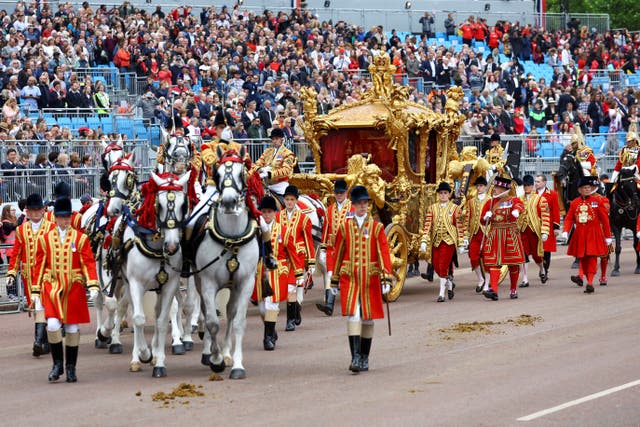 <p>The Gold State Coach passes in front of Buckingham Palace during the Platinum Jubilee Pageant</p>