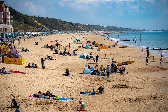 <p>People enjoying the warm weather on Bournemouth beach over the Easter Bank Holiday weekend</p>