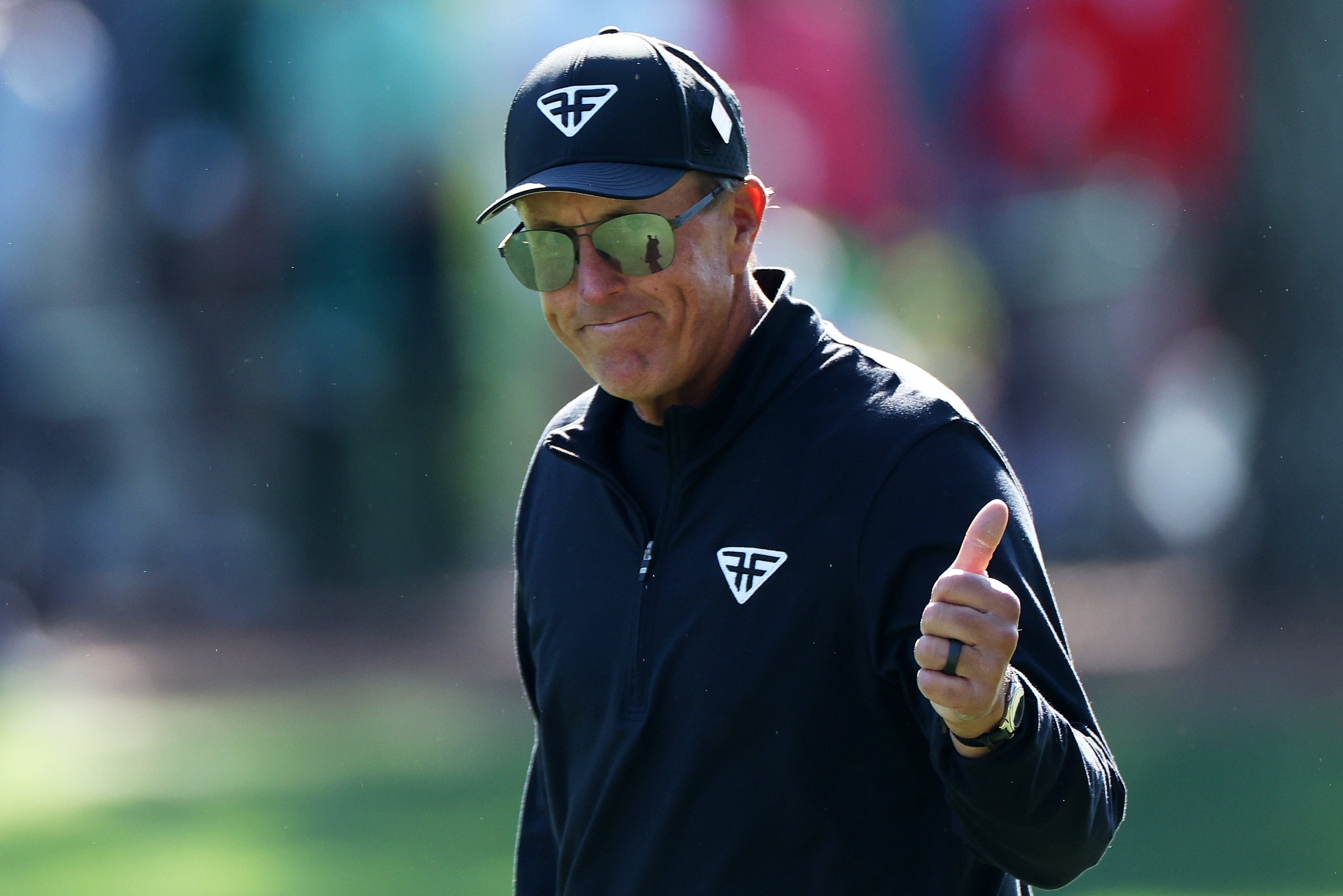Phil Mickelson swept aside recent controversies to post a brilliant final round of 65