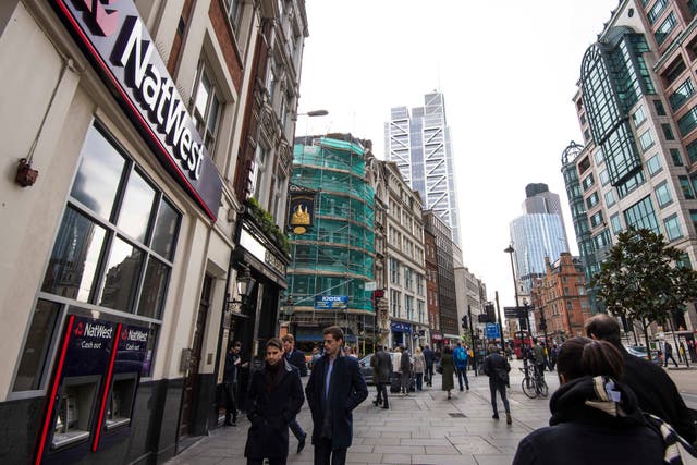 A third of people in the UK would rather do all their banking in person, a survey has found (Matt Crossick/ PA)