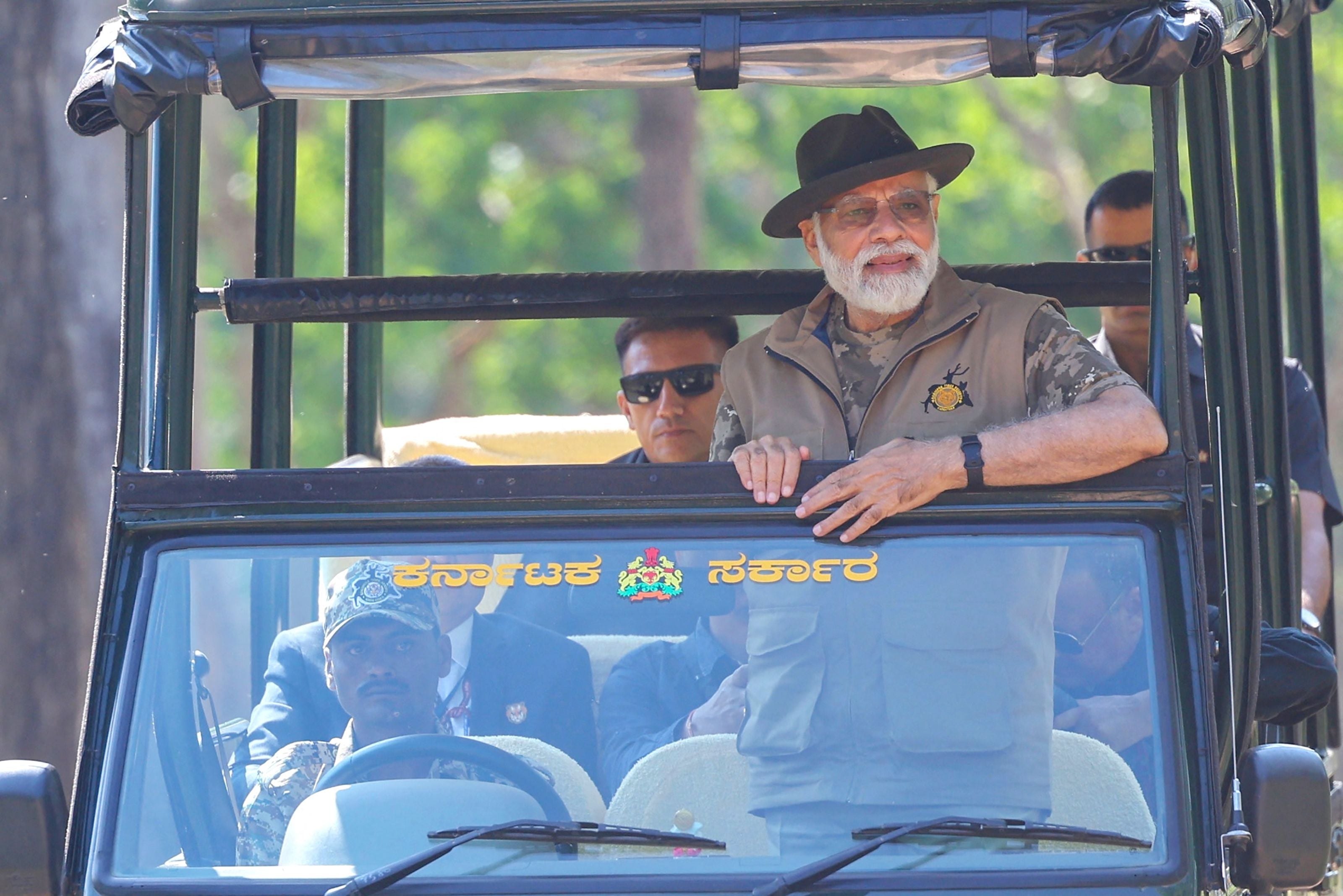 This handout photograph taken on 9 April 2023 and released by the Indian Press Information Bureau (PIB) shows India’s prime minister Narendra Modi taking a jungle safari during his visit to the Bandipur and Mudumalai Tiger Reserves, in Karnataka state