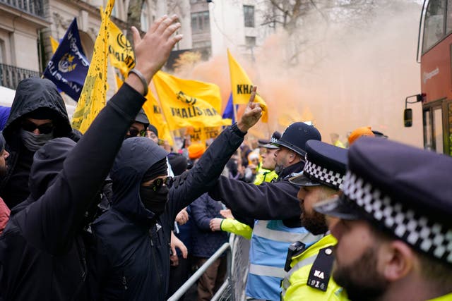 <p>Police officers push back protestors of the Khalistan movement during a demonstration outside of the Indian High Commission in London</p>