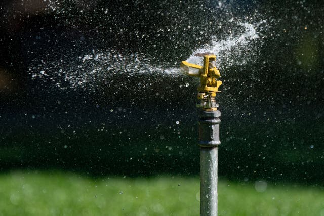 Overconsumption of water for gardens and other forms of leisure leaves poorer people worse off, researchers said (Dominic Lipinski/PA)